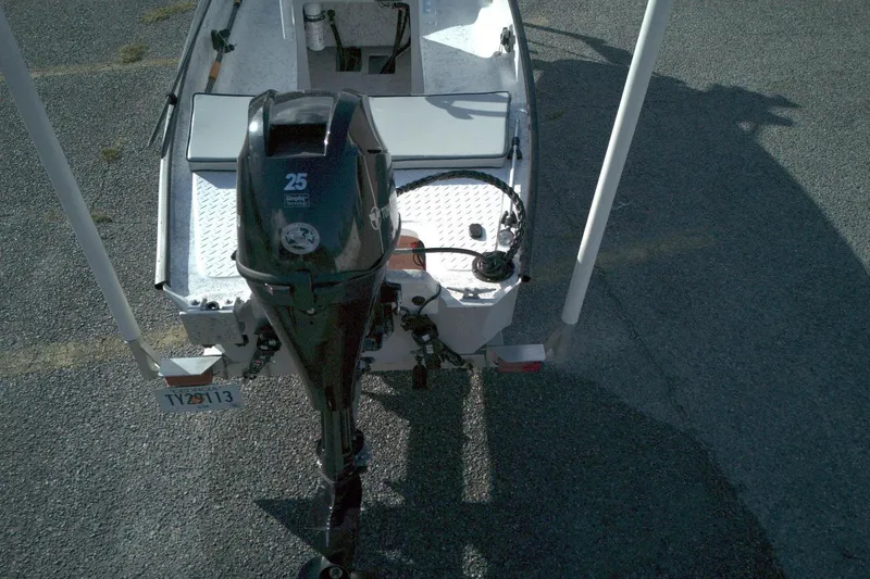 Slide: The Image of 2023 Santee 16CC boat with 25HP outboard motor, viewed from above. - 8