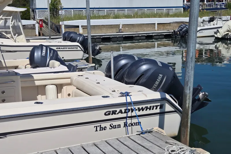 Slide: The Image of 2016 Grady-White Freedom 275 boat docked with Yamaha engines. - 17