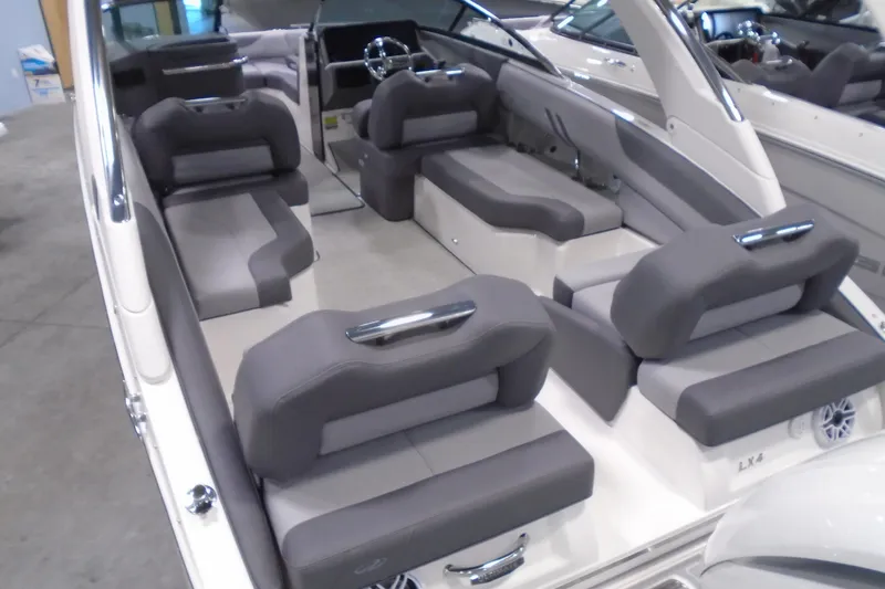 Slide: The Image of 2026 Regal LX4 boat interior with luxurious gray seating and modern design. - 10