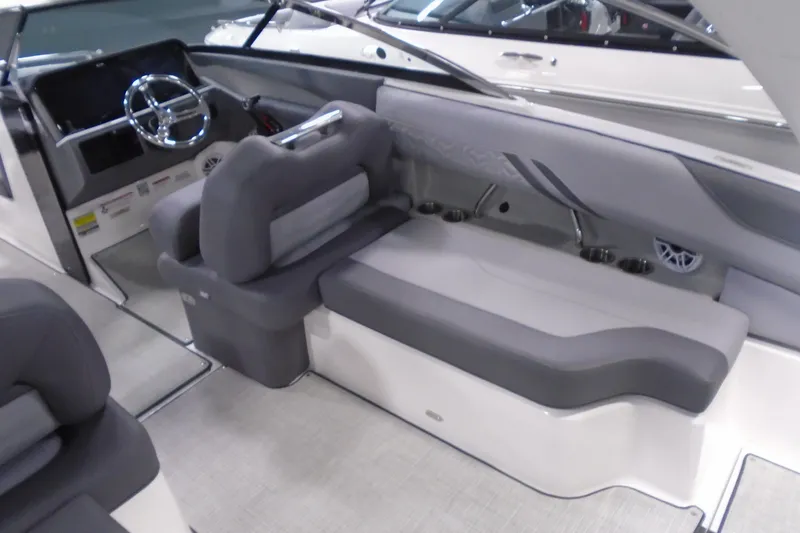Slide: The Image of 2026 Regal LX4 boat interior with gray seating and modern dashboard design. - 12