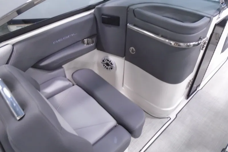 Slide: The Image of 2026 Regal LX4 boat interior with sleek gray seating and modern design elements. - 16