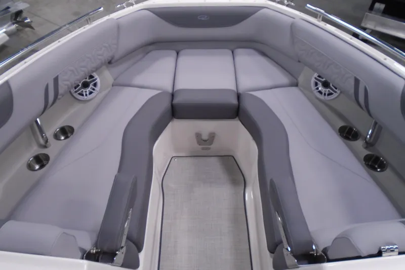 Slide: The Image of Luxurious seating area of 2026 Regal LX4 boat with cup holders and speakers. - 18