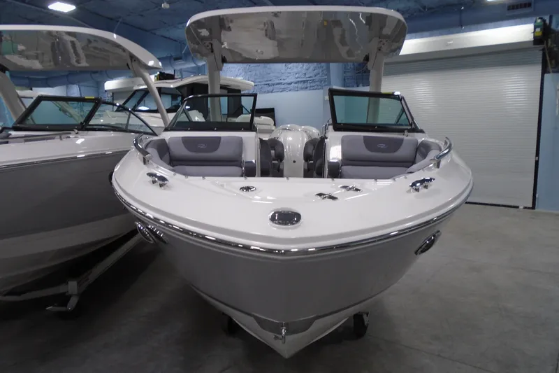 Slide: The Image of 2026 Regal LX4 boat in showroom, featuring sleek design and modern amenities. - 5