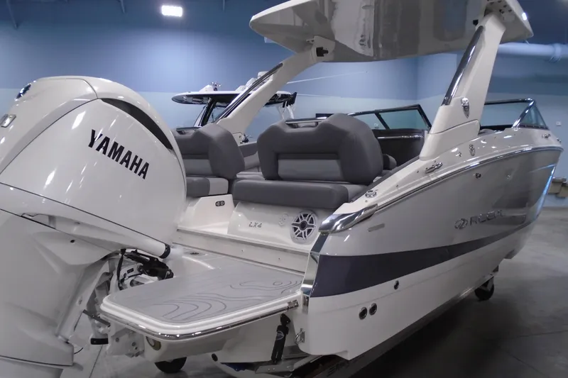 Slide: The Image of 2026 Regal LX4 boat with Yamaha engine, featuring sleek design and comfortable seating. - 8