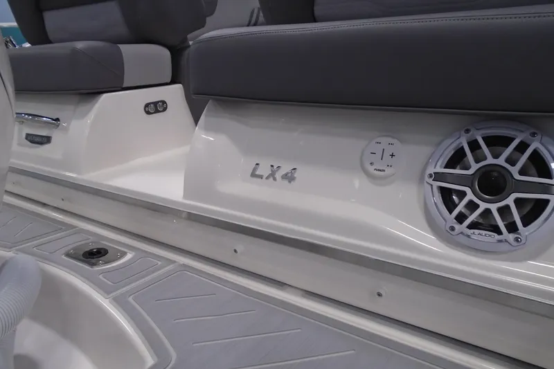 Slide: The Image of 2026 Regal LX4 boat interior with speaker and seating detail. - 9