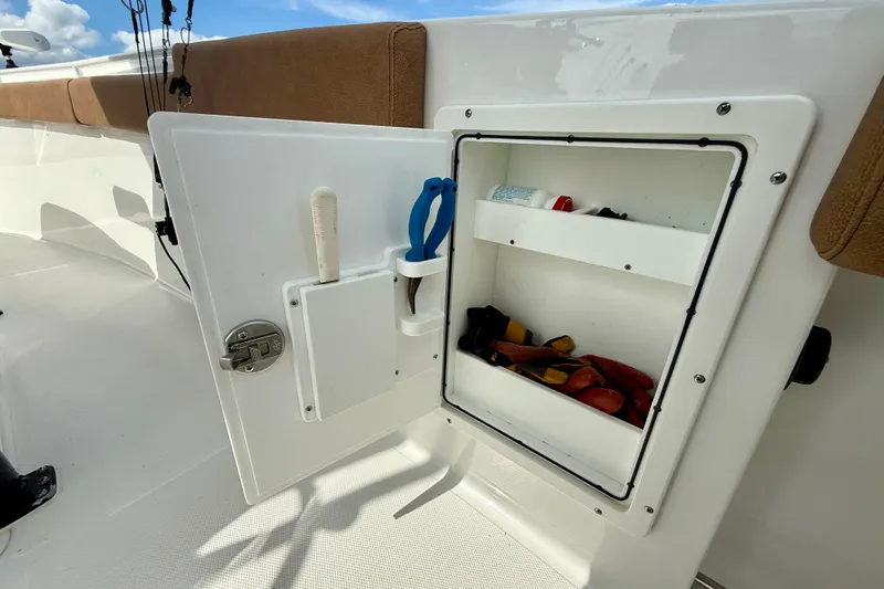 Slide: The Image of 2021 Sea Hunt Gamefish 27 Coffin Box storage compartment with tools and accessories. - 42
