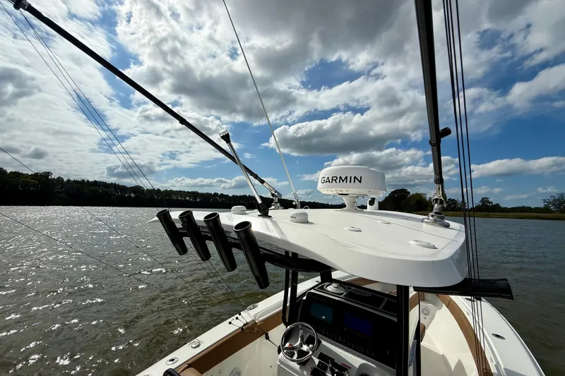 Slide: The Image of 2021 Sea Hunt Gamefish 27 Coffin Box boat with Garmin equipment on a sunny day. - 45