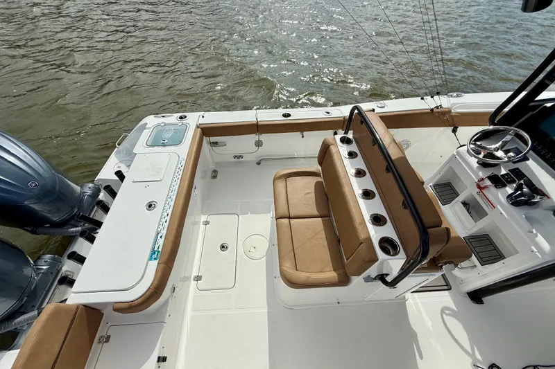 Slide: The Image of 2021 Sea Hunt Gamefish 27 Coffin Box boat interior with seating and control panel. - 47