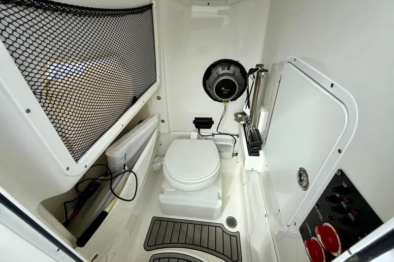 Slide: The Image of 2021 Sea Hunt Gamefish 27 Coffin Box interior with toilet and storage features. - 49