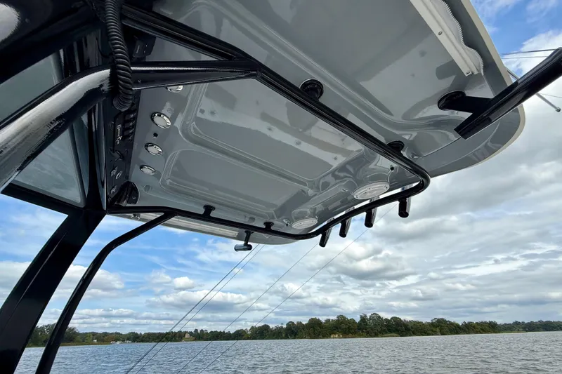 Slide: The Image of 2021 Sea Hunt Gamefish 27 Coffin Box boat canopy with scenic water view. - 51