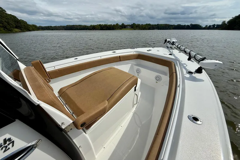 Slide: The Image of 2021 Sea Hunt Gamefish 27 Coffin Box boat on a serene lake. - 9