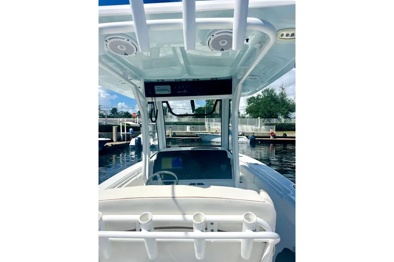 Slide: The Image of 2020 Sea Hunt Gamefish 27 boat with forward seating, docked in a marina. - 7