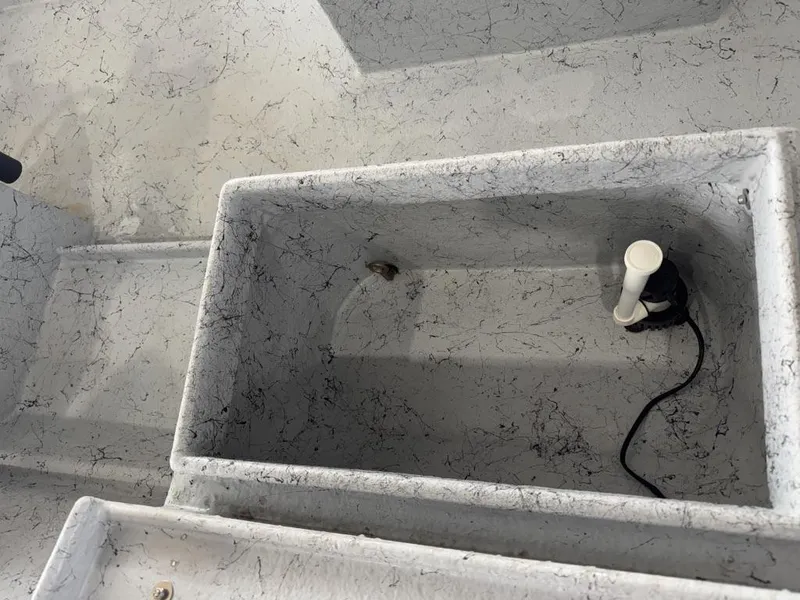 Slide: The Image of Interior of 2022 Reno Skiff 16 Custom boat with storage compartment and pump. - 4