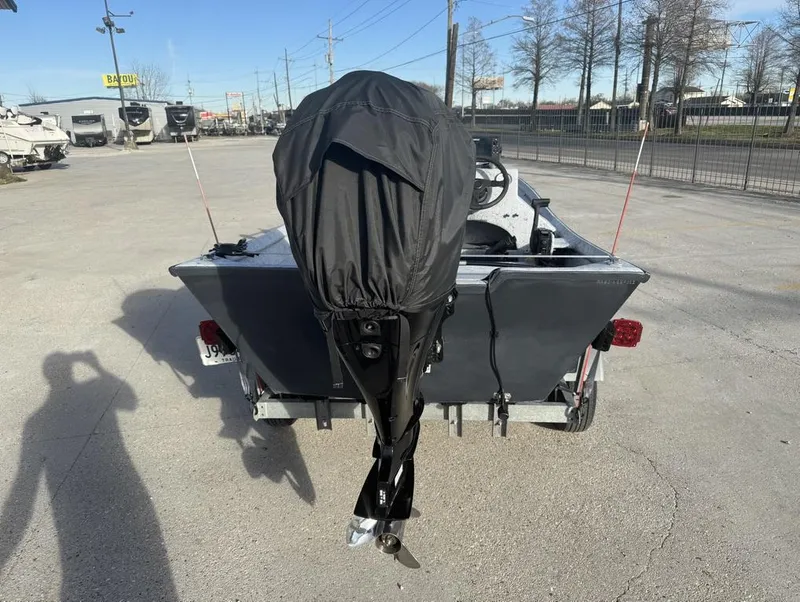 Slide: The Image of 2022 Custom Reno Skiff 16 boat with covered outboard motor on trailer. - 8