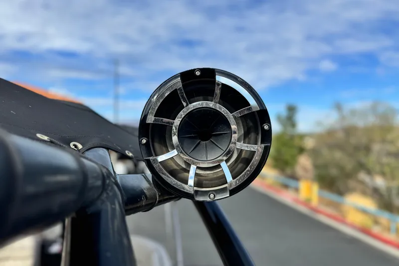 Slide: The Image of Close-up of a 2015 Bennington 2575 QCW boat speaker against a blue sky. - 10