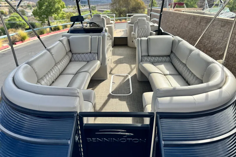 Slide: The Image of 2015 Bennington 2575 QCW pontoon boat with luxurious seating and spacious deck. - 11