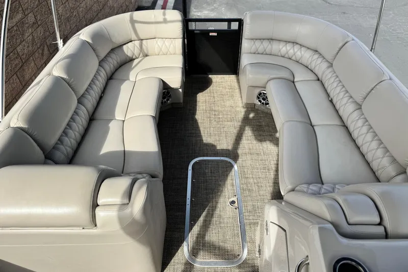 Slide: The Image of Luxurious interior of 2015 Bennington 2575 QCW pontoon boat with plush seating. - 13