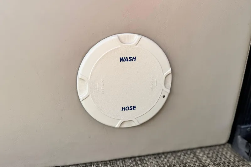 Slide: The Image of Wash hose access panel on 2015 Bennington 2575 QCW boat. - 16