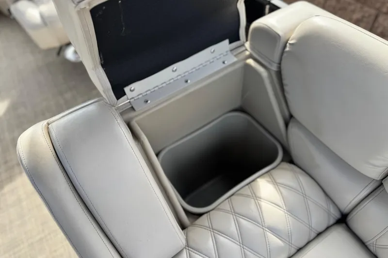 Slide: The Image of 2015 Bennington 2575 QCW boat seat with built-in storage compartment. - 18