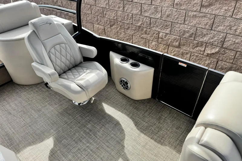 Slide: The Image of Luxurious seating on 2015 Bennington 2575 QCW boat with cup holders and speaker. - 20