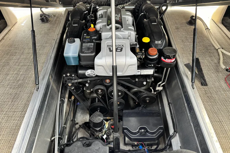 Slide: The Image of Engine compartment of a 2015 Bennington 2575 QCW boat, featuring a Big Block V8 engine. - 26