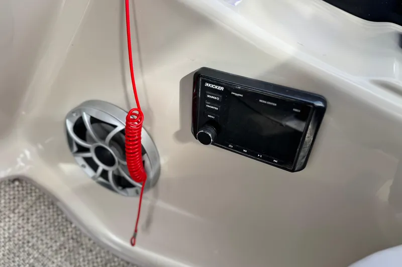 Slide: The Image of 2015 Bennington 2575 QCW boat dashboard with Kicker media center and speaker. - 32