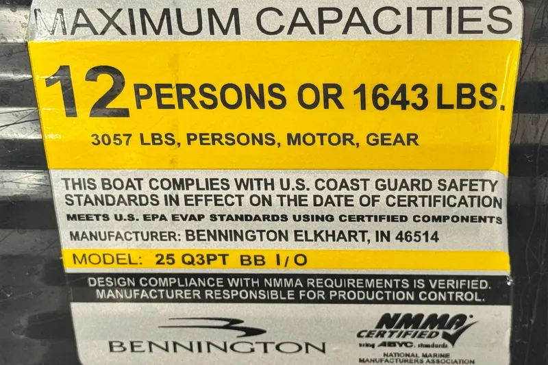 Slide: The Image of 2015 Bennington 2575 QCW boat capacity label, 12 persons or 1643 lbs, safety compliance. - 35