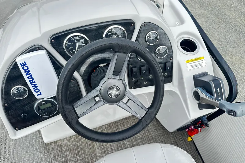 Slide: The Image of Steering console of 2017 Godfrey Sweetwater 2286 Tri Toon with Lowrance device. - 5