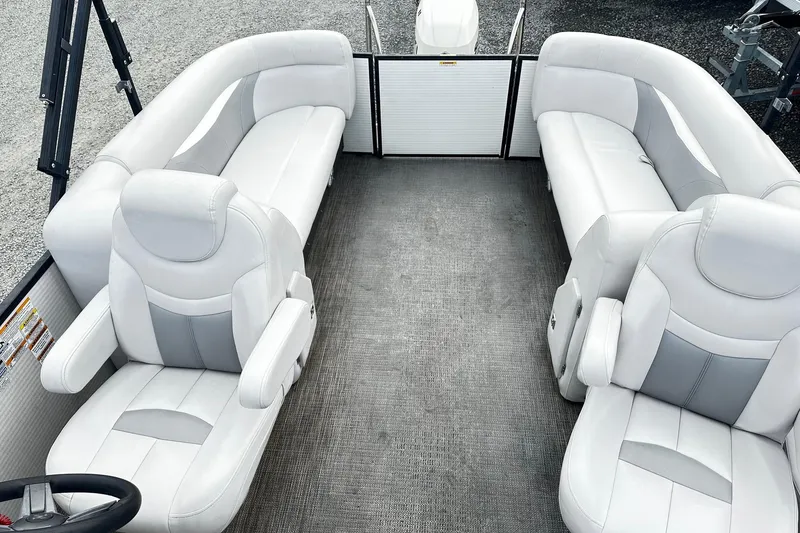 Slide: The Image of 2017 Godfrey Sweetwater 2286 Tri Toon interior with white seating and spacious layout. - 7