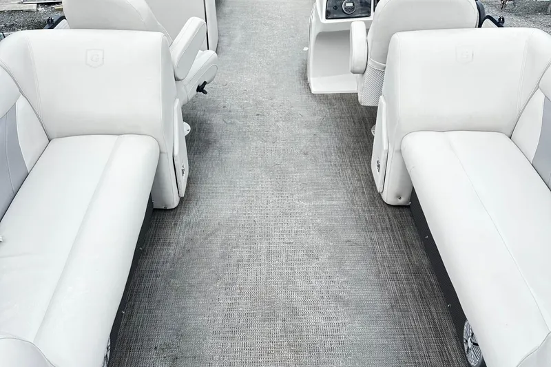 Slide: The Image of 2017 Godfrey Sweetwater 2286 Tri Toon interior with white seating and console. - 8