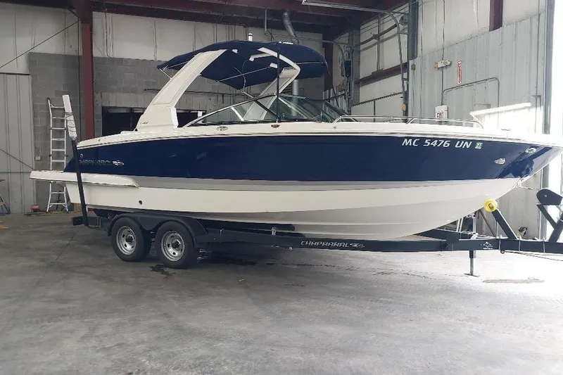 The Image of 2021 Chaparral 267 SSX boat on trailer in indoor storage facility. - 0