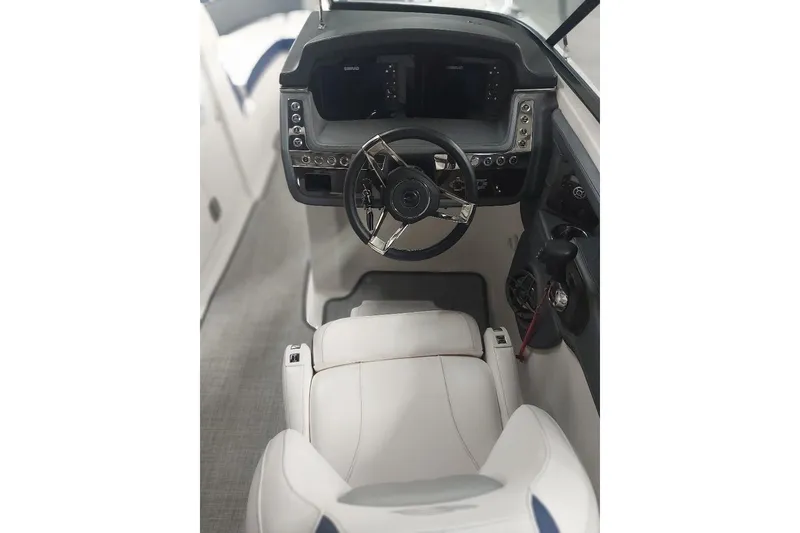 Slide: The Image of 2021 Chaparral 267 SSX boat cockpit with modern steering and controls. - 10