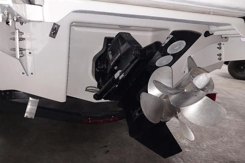 Slide: The Image of Stern view of 2021 Chaparral 267 SSX boat with dual propeller system. - 5