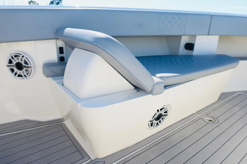 Slide: The Image of 2020 SeaVee 370z boat interior with cushioned seating and built-in speakers. - 13