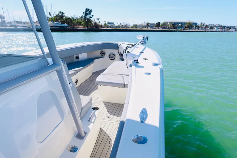 Slide: The Image of 2020 SeaVee 370z boat on calm water, featuring spacious deck and seating. - 15