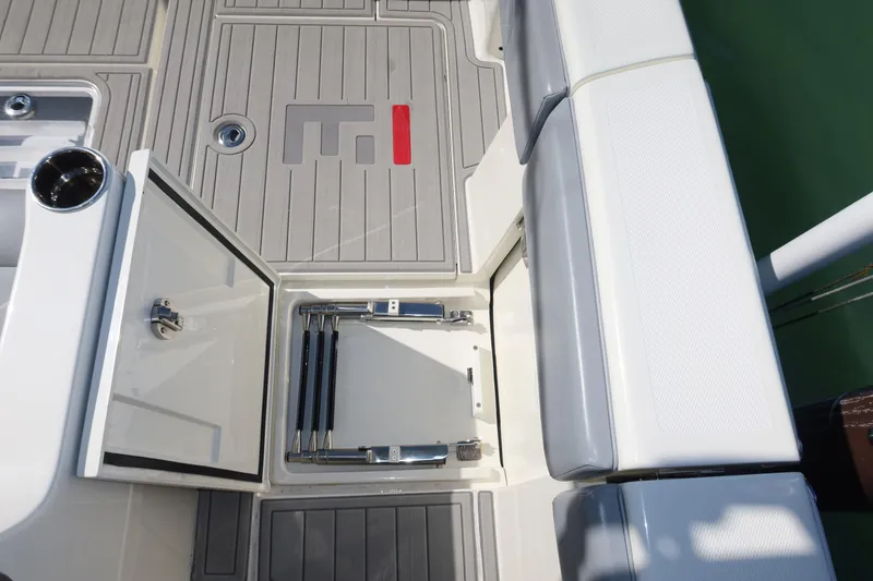 Slide: The Image of 2020 SeaVee 370z boat deck with storage compartment and seating. - 17