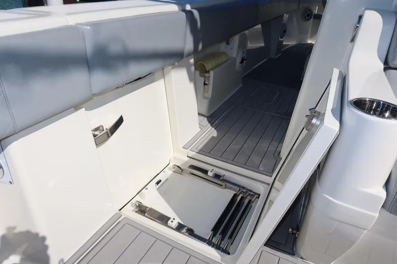 Slide: The Image of 2020 SeaVee 370z boat interior with open storage compartments and sleek design. - 18