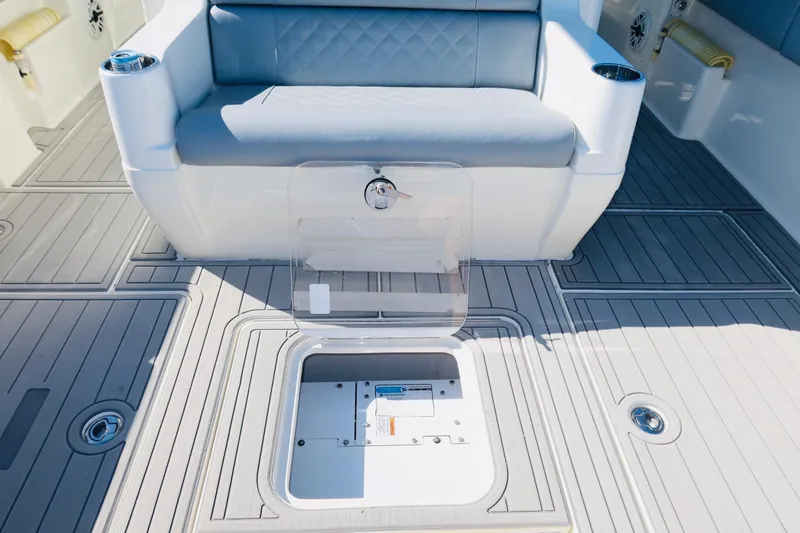 Slide: The Image of 2020 SeaVee 370z boat interior with cushioned seating and open storage compartment. - 26