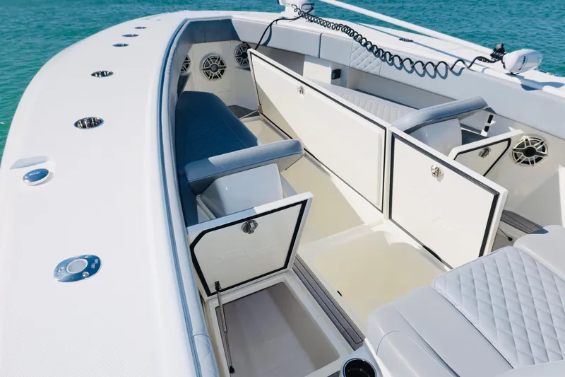 Slide: The Image of 2020 SeaVee 370z boat interior with open storage compartments and seating. - 37