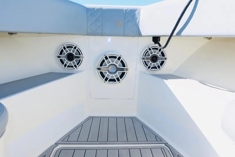 Slide: The Image of 2020 SeaVee 370z boat interior with speakers and cushioned seating. - 39