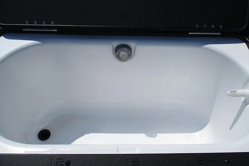 Slide: The Image of 2025 Viaggio Lago X20R livewell interior, featuring a clean, white design with drainage and aeration system. - 27