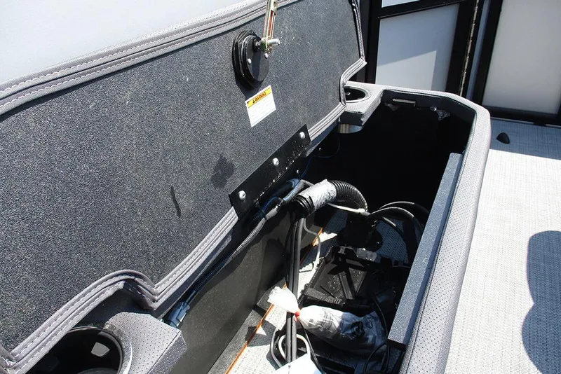 Slide: The Image of Open storage compartment in 2025 Viaggio Lago X20R boat, showcasing interior wiring and components. - 31