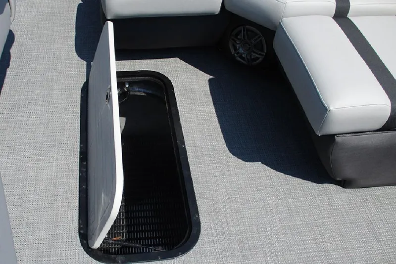 Slide: The Image of Open storage compartment on Viaggio Lago X20R boat, 2025 model, with gray seating and flooring. - 36