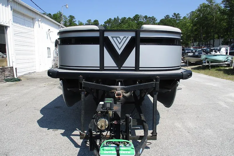 Slide: The Image of 2025 Viaggio Lago X20R pontoon boat on trailer, parked outdoors. - 4