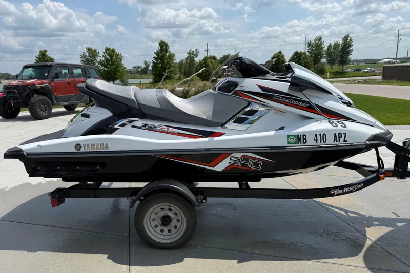 Slide: The Image of 2014 Yamaha WaveRunner FX SHO on trailer, parked outdoors under a cloudy sky. - 4