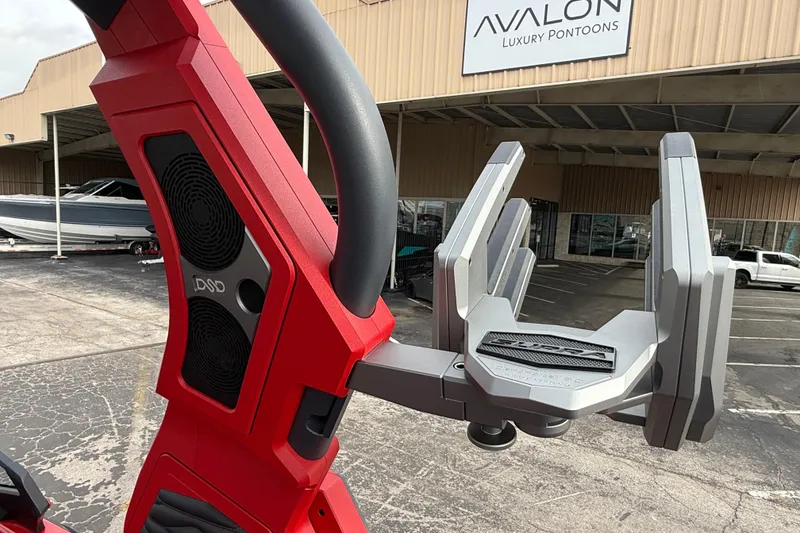 Slide: The Image of Red Supra SE 550 boat detail with speakers, parked near Avalon Luxury Pontoons. - 22