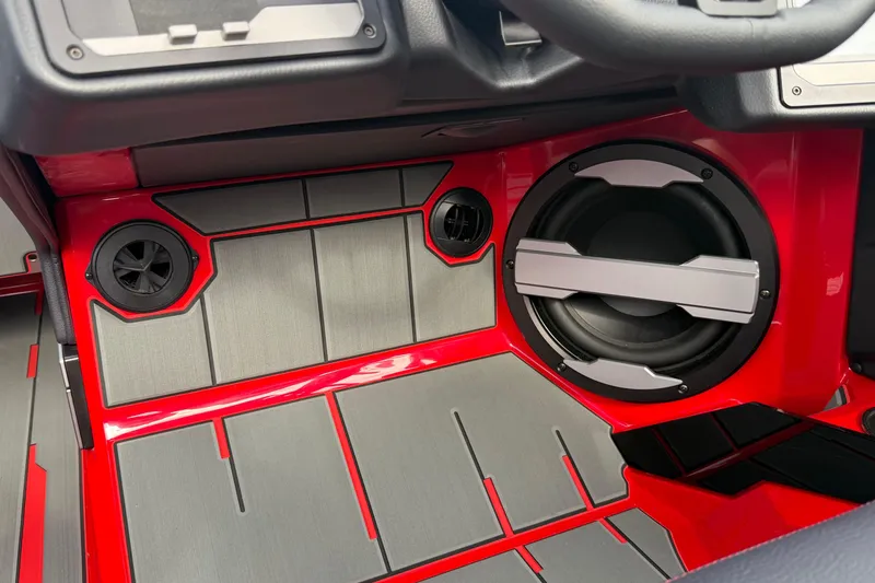 Slide: The Image of 2026 Supra SE 550 interior with red and gray speaker system. - 28