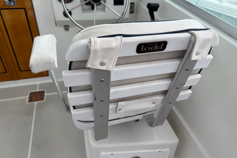 Slide: The Image of Captain's chair on 2005 Back Cove 26 boat, featuring Todd Enterprises design. - 24