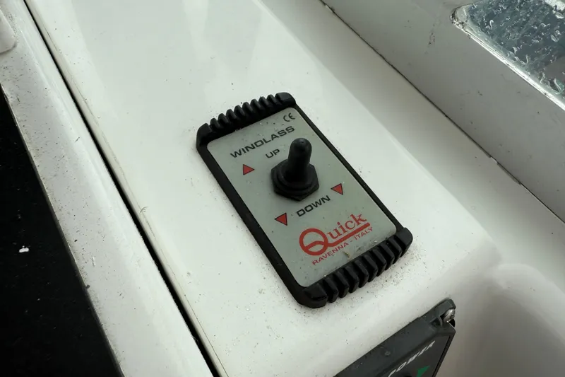 Slide: The Image of Windlass control panel on 2005 Back Cove 26 boat, featuring Quick brand switch. - 31