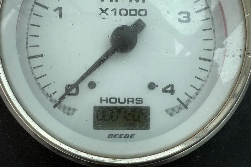 Slide: The Image of Tachometer of 2005 Back Cove 26 boat showing RPM and engine hours. - 38